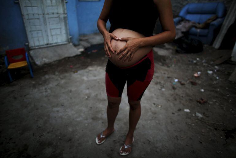 Patricia Araujo, 23, who is seven months pregnant, poses in front of her stilt house, a lake dwelling also known as palafitte or &#039;Palafito&#039;, in Recife &#039;Palafito&#039;, en Recife, Brasil