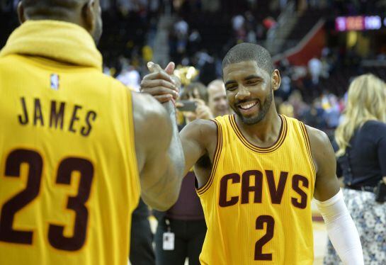 May 12, 2015; Cleveland, OH, USA; Cleveland Cavaliers forward LeBron James (23) celebrates with guard Kyrie Irving (2) after a 106-101 win over the Chicago Bulls in game five of the second round of the NBA Playoffs at Quicken Loans Arena. Mandatory Credit