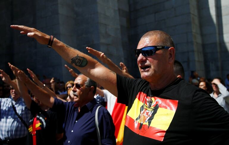 People attend a demonstration against plans by Spain&#039;s Socialist government to remove the remains of fascist dictator Francisco Franco from the Valle de los Caidos state-funded mausoleum. 