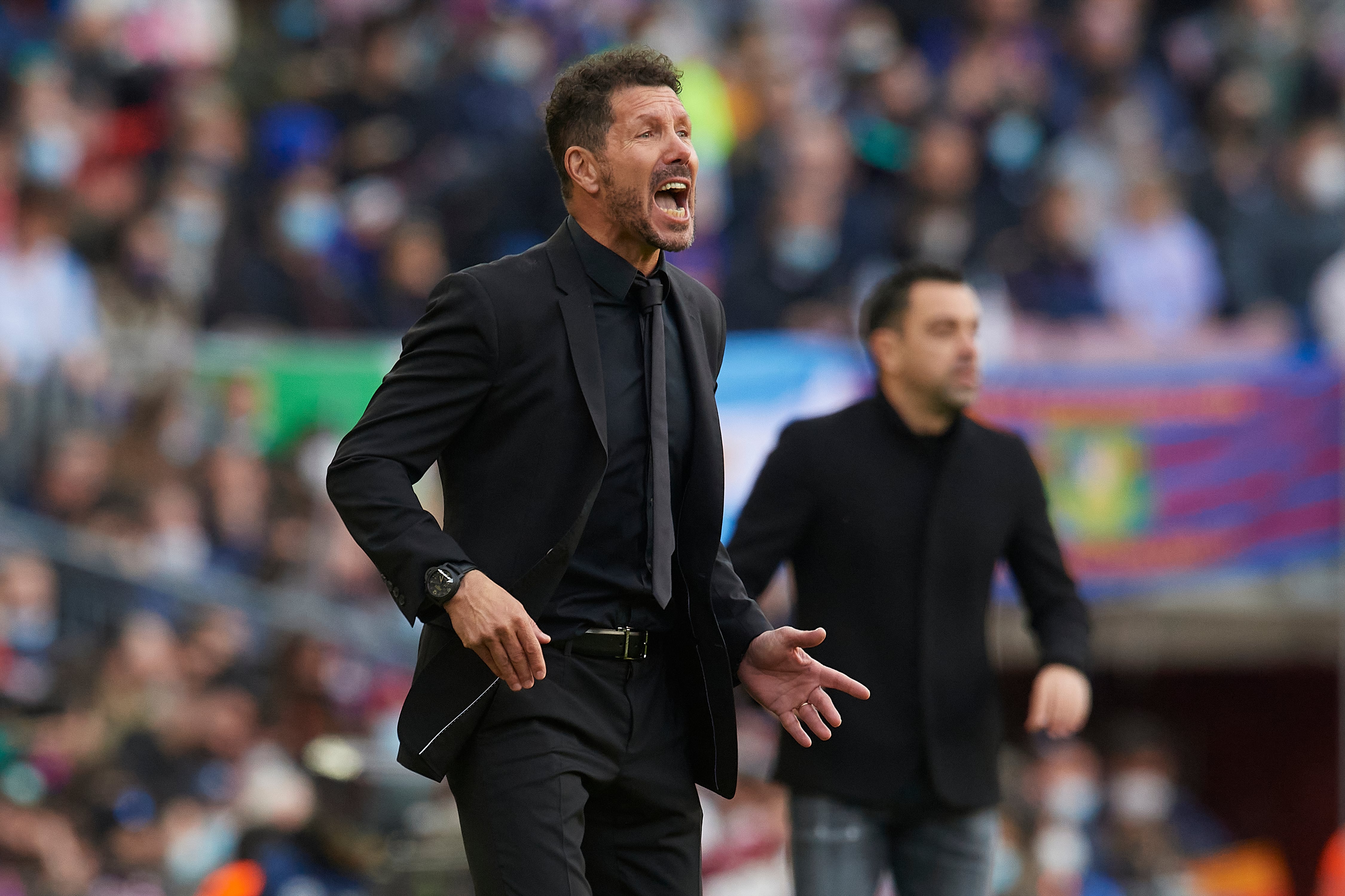 Diego Simeone y Xavi Hernández durante el último enfrentamiento entre ambos.