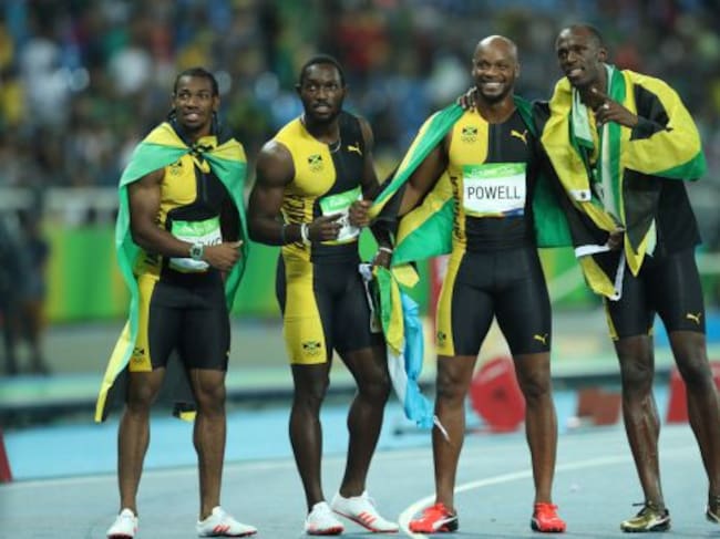RIO DE JANEIRO, BRAZIL - AUGUST 19: Usain Bolt of Jamaica celebrates with teammates Asafa Powell, Yohan Blake and Nickel Ashmeade after winning the Men's 4 x 100m Relay Final on Day 14 of the Rio 2016 Olympic Games at the Olympic Stadium on August 19, 201