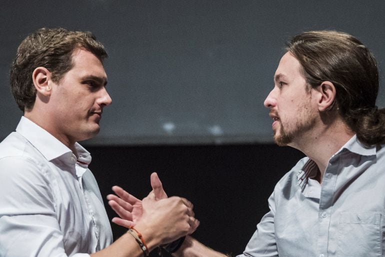 Los candidatos a la presidencia del Gobierno de Ciudadanos, Albert Rivera, y Podemos, Pablo Iglesias, durante el debate electoral que ha organizado hoy en la Universidad Carlos III de Madrid. 