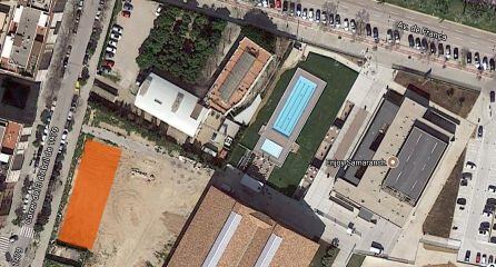 Vista área del solar reservado a zona verde de la calle 3 de abril de 1979; en naranja la superficie aproximada que se permutará a Guadalmedina