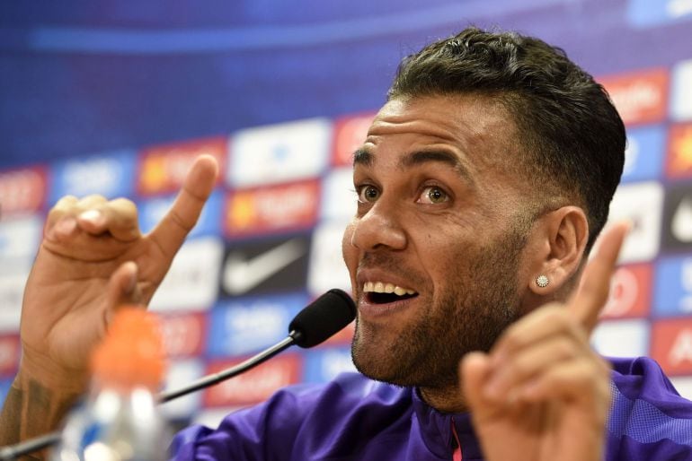 Barcelona's Brazilian defender Dani Alves gestures as he gives a press conference at the Sports Center FC Barcelona Joan Gamper in Sant Joan Despi, near Barcelona on May 25, 2015. AFP PHOTO/ LLUIS GENE