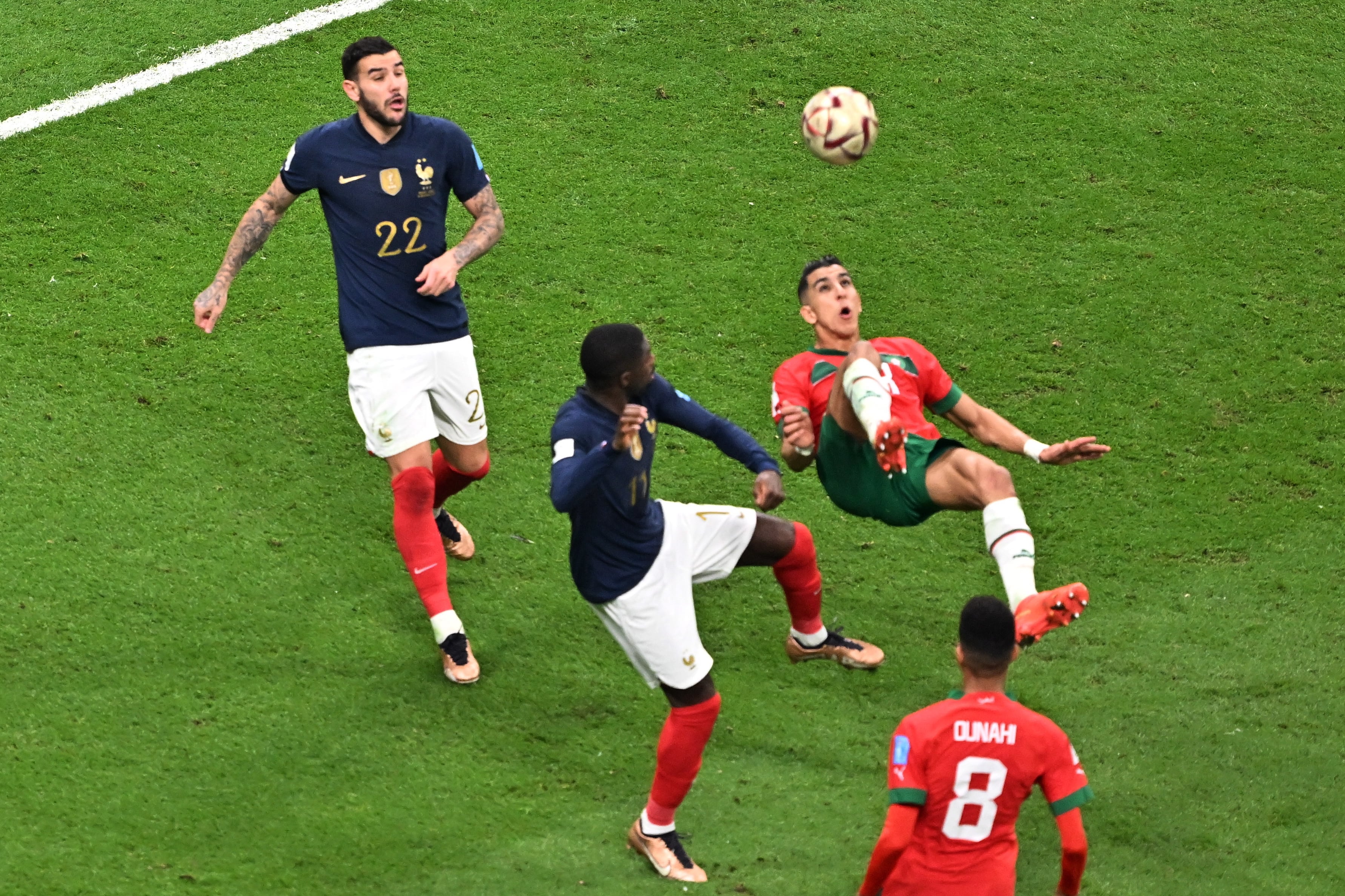 Al Khor (Qatar), 14/12/2022.- Jawad El Yamiq of Morocco (R) attempts an overhead kick during the FIFA World Cup 2022 semi final between France and Morocco at Al Bayt Stadium in Al Khor, Qatar, 14 December 2022. (Mundial de Fútbol, Francia, Marruecos, Catar) EFE/EPA/Noushad Thekkayil
