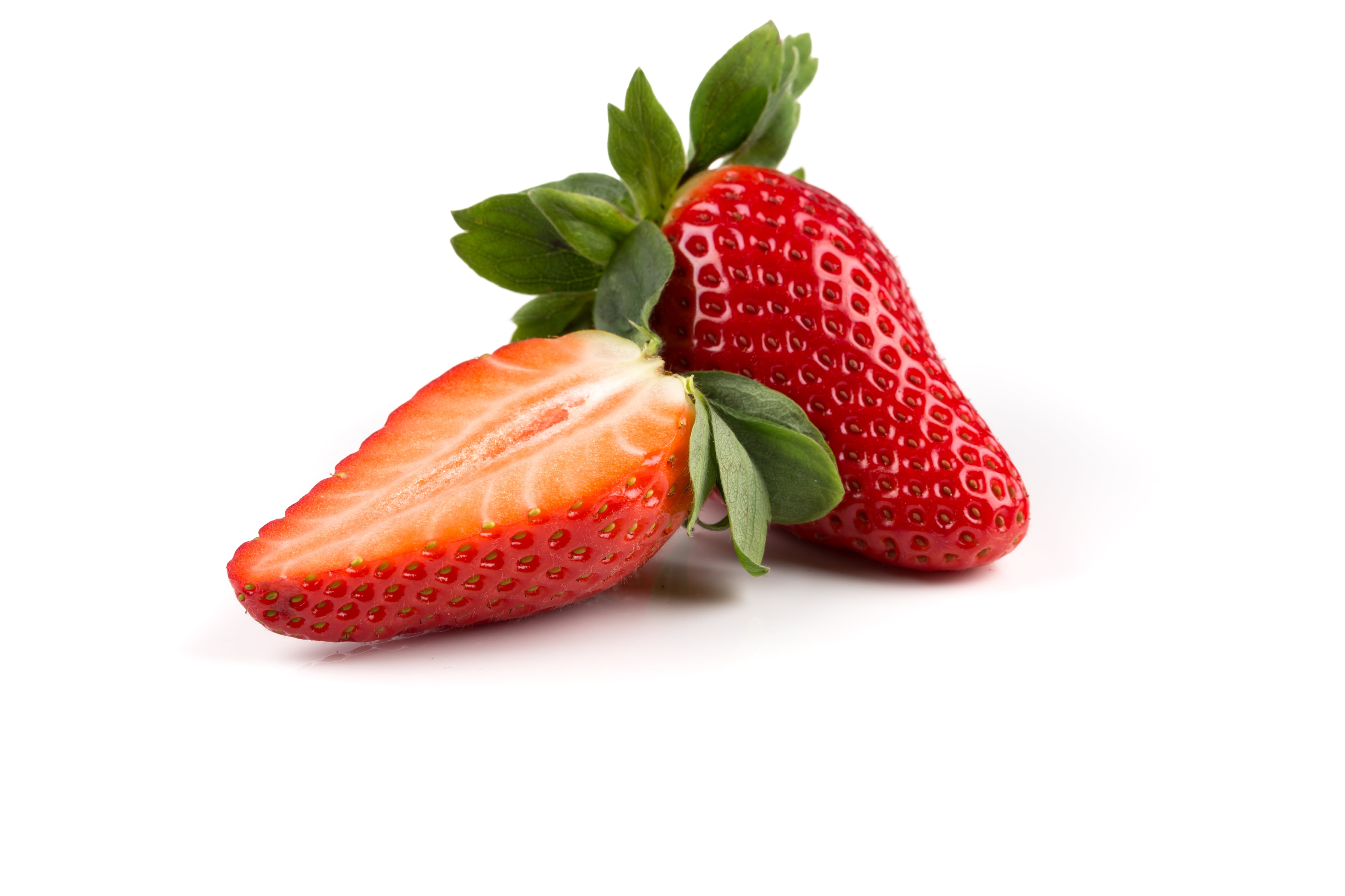 Red ripe strawberry fruits on a white background