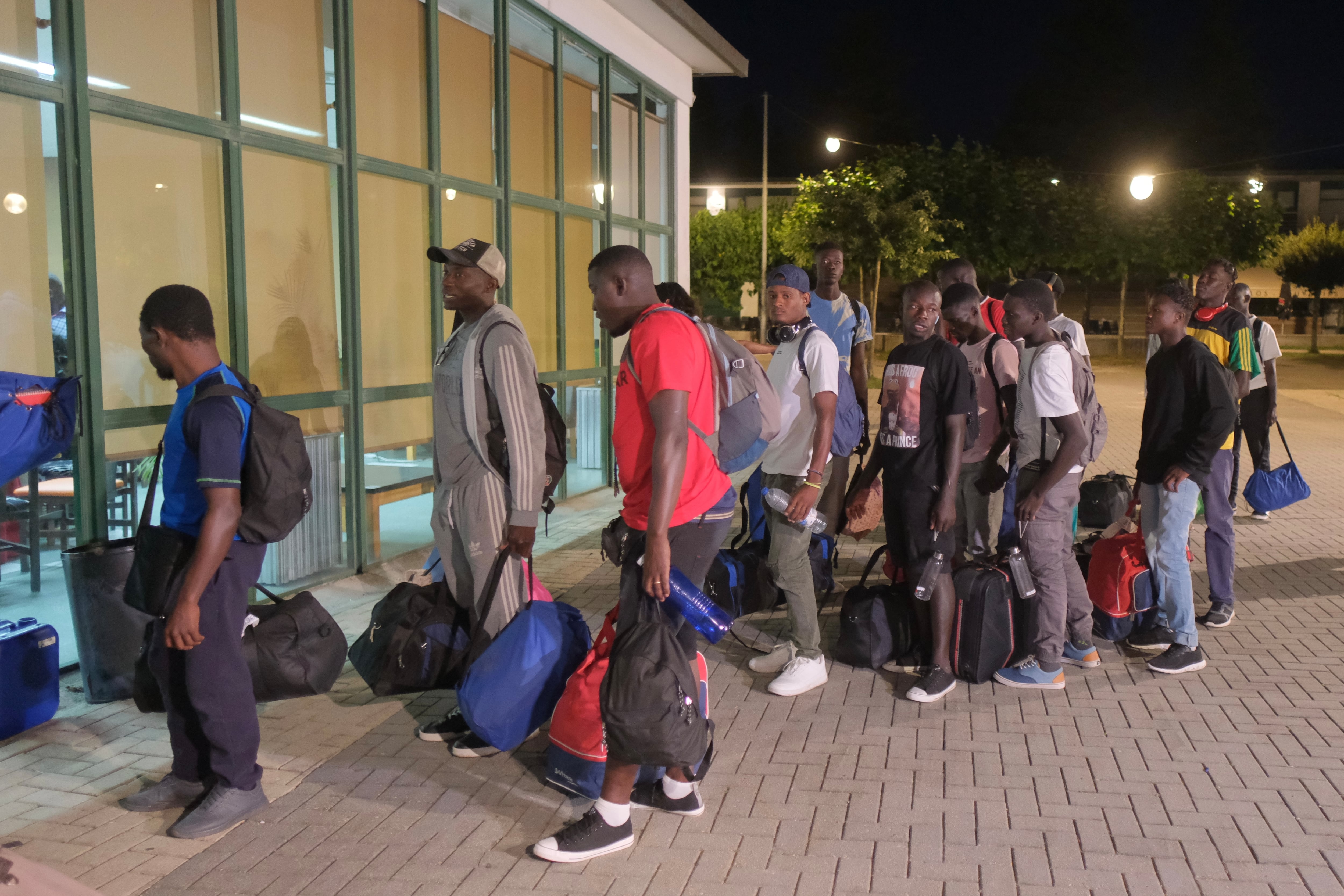 SANTIAGO DE COMPOSTELA, A CORUÑA, SPAIN - JULY 30: Refugees from the war in Mali, on their arrival at Monte do Gozo, July 30, 2024, in Santiago de Compostela, A Coruña, Galicia, Spain. The first immigrants from the Canary Islands to be welcomed this summer in Galicia begin to arrive today at the Monte do Gozo shelter in Santiago. They are refugees who have already started the procedures to apply for asylum and have already spent a period of adaptation in the islands. A first group of 100 people is expected to arrive at the shelter in Santiago de Compostela this week. The Diputacion de A Coruña offers 44 places for these people. (Photo By Cesar Arxina/Europa Press via Getty Images)