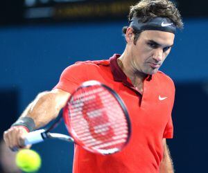 BRISBANE, AUSTRALIA - JANUARY 09: Roger Federer of Sweden plays a backhand in his match against James Duckworth of Australia during day six of the 2015 Brisbane International at Pat Rafter Arena on January 9, 2015 in Brisbane, Australia. (Photo by Bradley