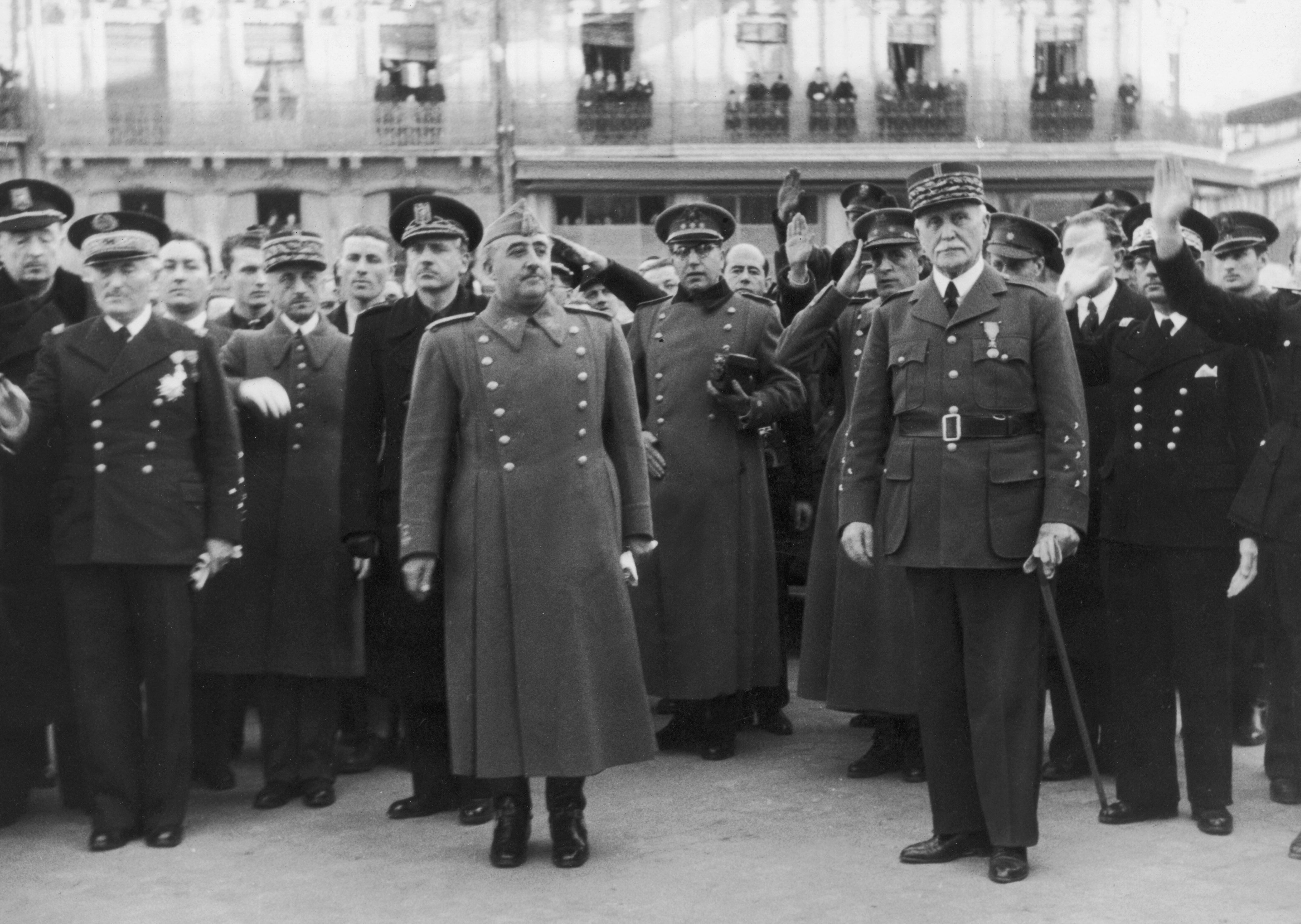 Spanish dictator General Francisco Franco (1892 - 1975, center left) during a visit to Vichy French leader Marshal Henri-Philippe Petain (1856 - 1951, centre right), circa 1942. Behind Franco is his brother-in-law and Spanish Foreign Minister, Ramon Serrano Suner (1901 - 2003), and on the far left is French Admiral Jean-Francois Darlan (1881 - 1942). Photo by Three Lions/Keystone/Hulton Archive/Getty Images. 