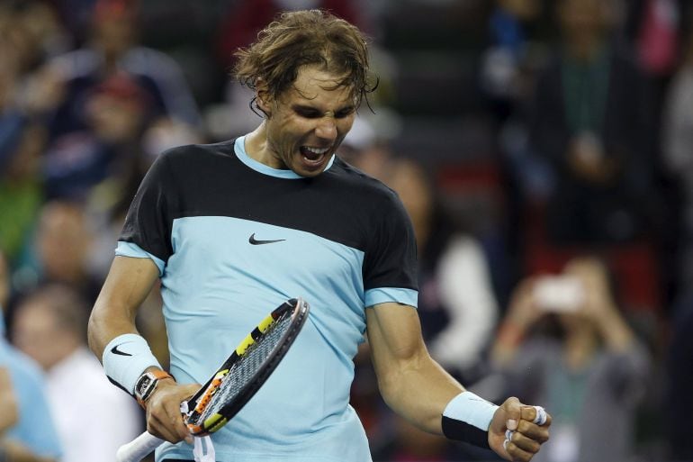 Rafael Nadal of Spain celebrates winning his men's singles tennis match against Milos Raonic of Canada at the Shanghai Masters tennis tournament in Shanghai, China, October 15, 2015. REUTERS/Aly Song