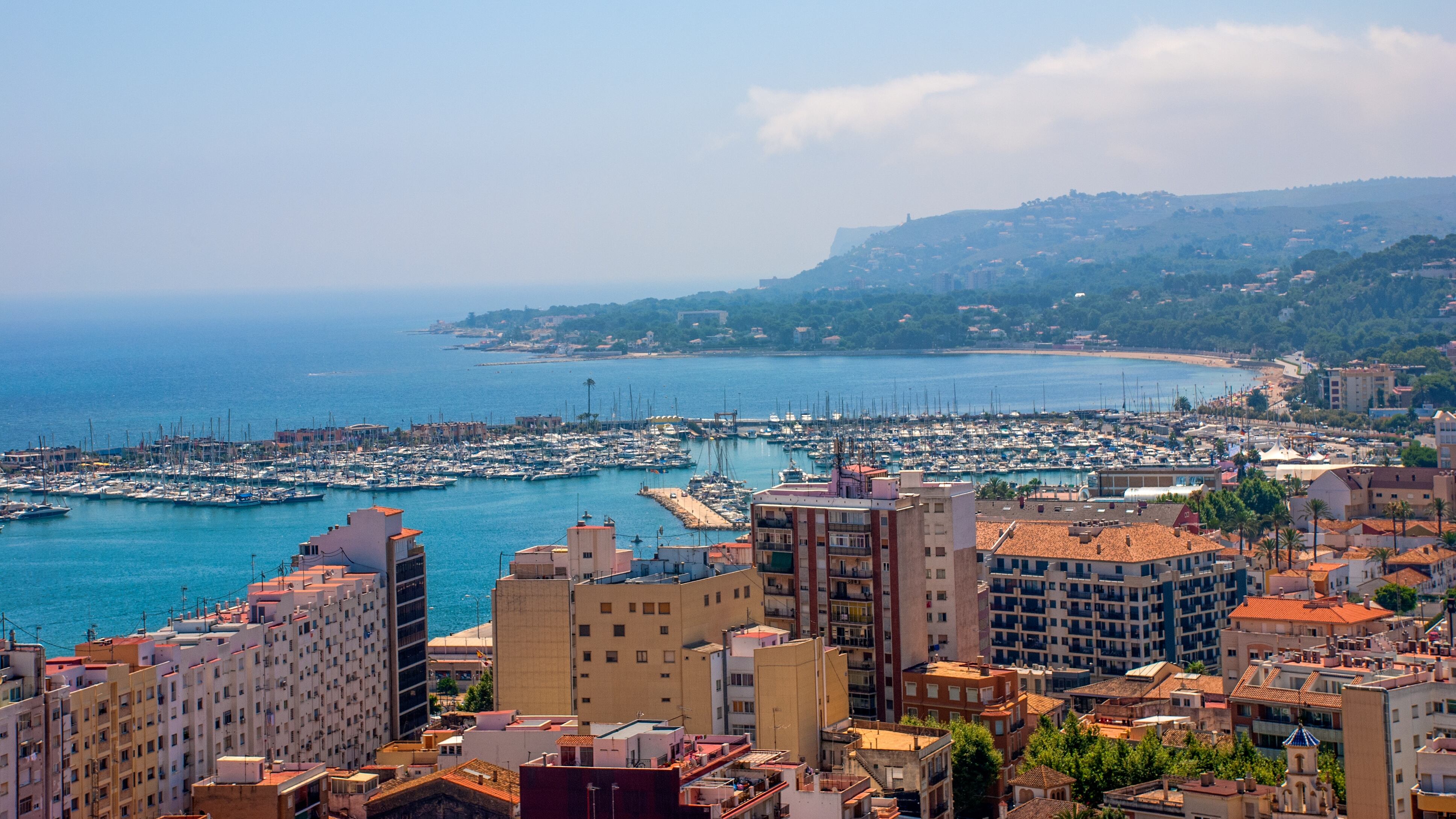 Denia town & marina as seen from Denia Castle on a hazy day in summertime, Denia, Valencia, Alicante, Spain, Europe, July 3 2008.