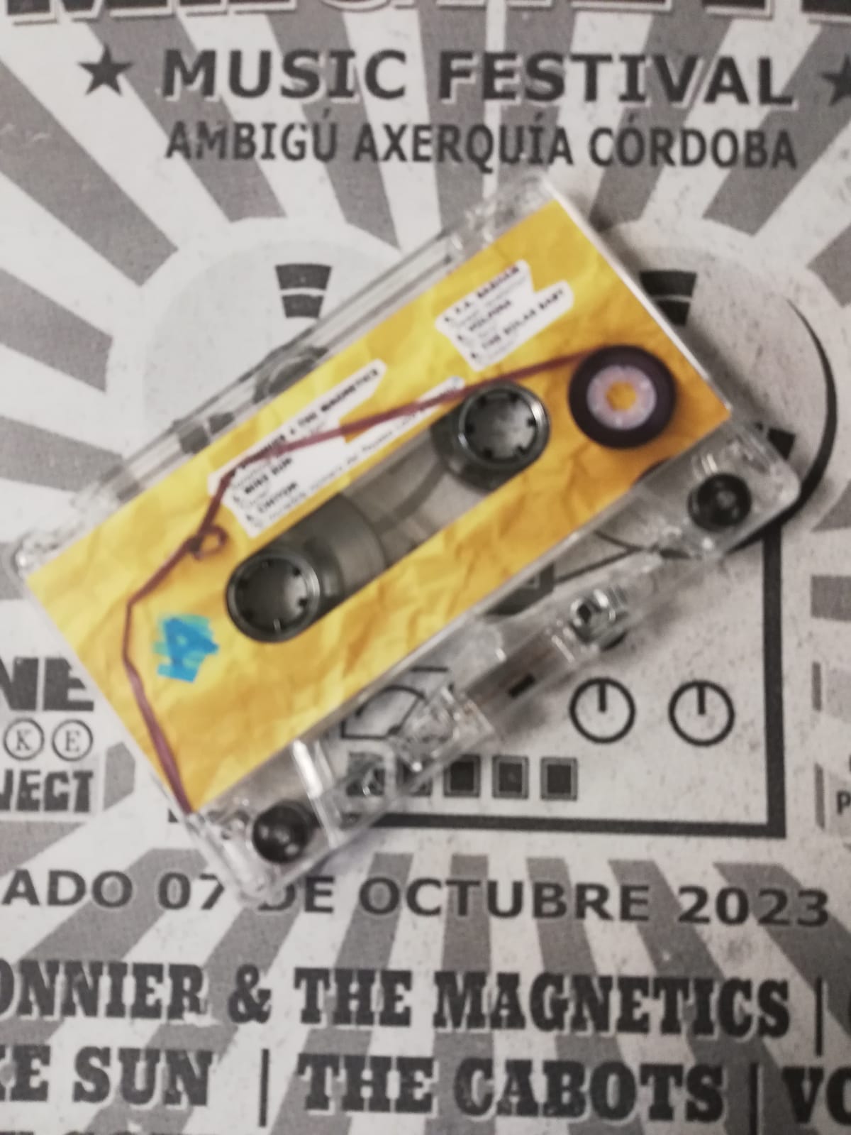 Cassette y cartel de One Take Project