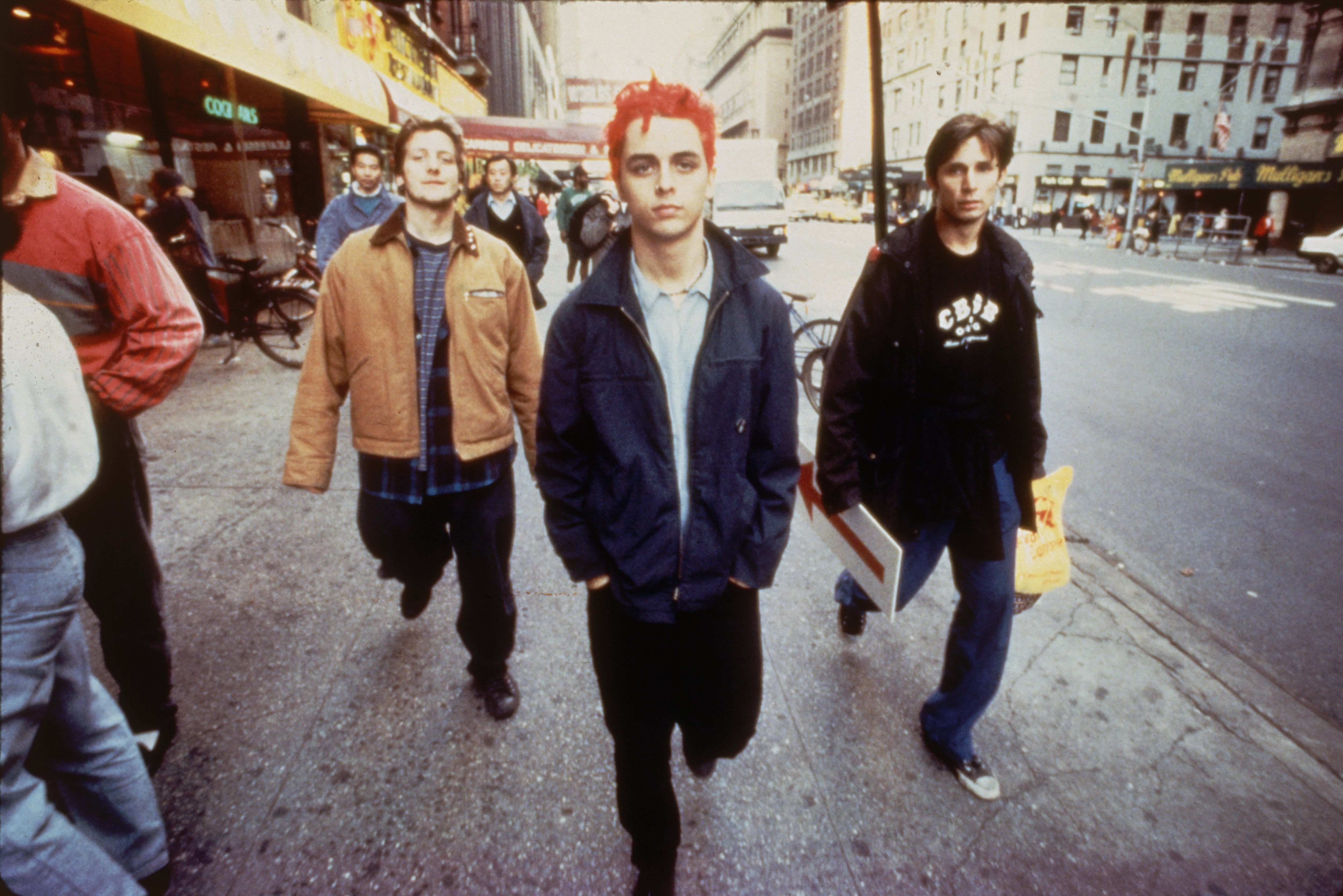 Punk rock trio Green Day (L-R) bassist Mike Dirnt, vocalist & guitarist Billie Joe (Armstrong) & drummer Tre Cool sauntering streets of NYC.  (Photo by Ken Schles/Getty Images)