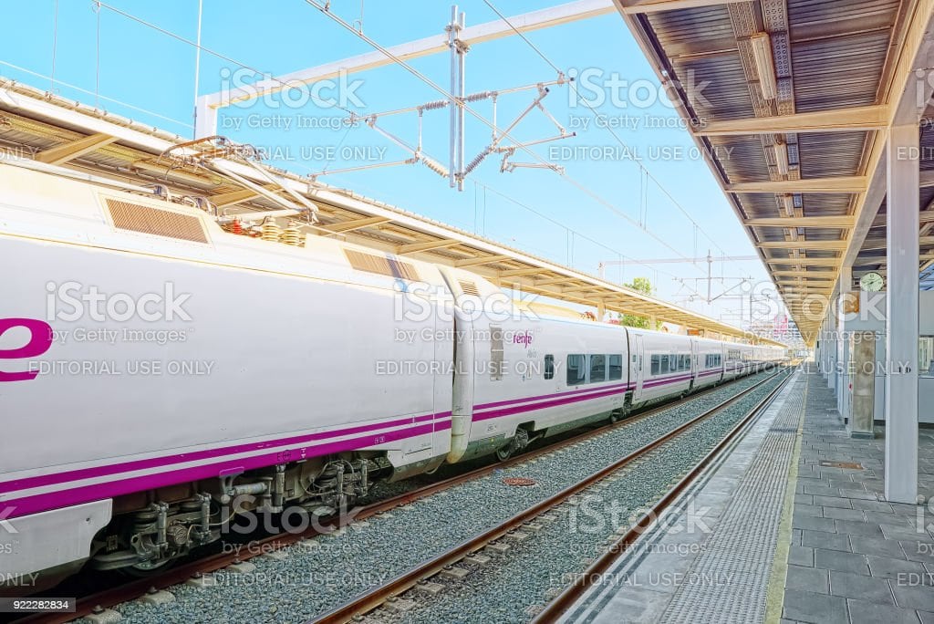 Valencia, Spain - June 13, 2017 : North Railways Station (Estacio del Nord) and modern hi-speed passenger train of Spanish railways company - Renfe.