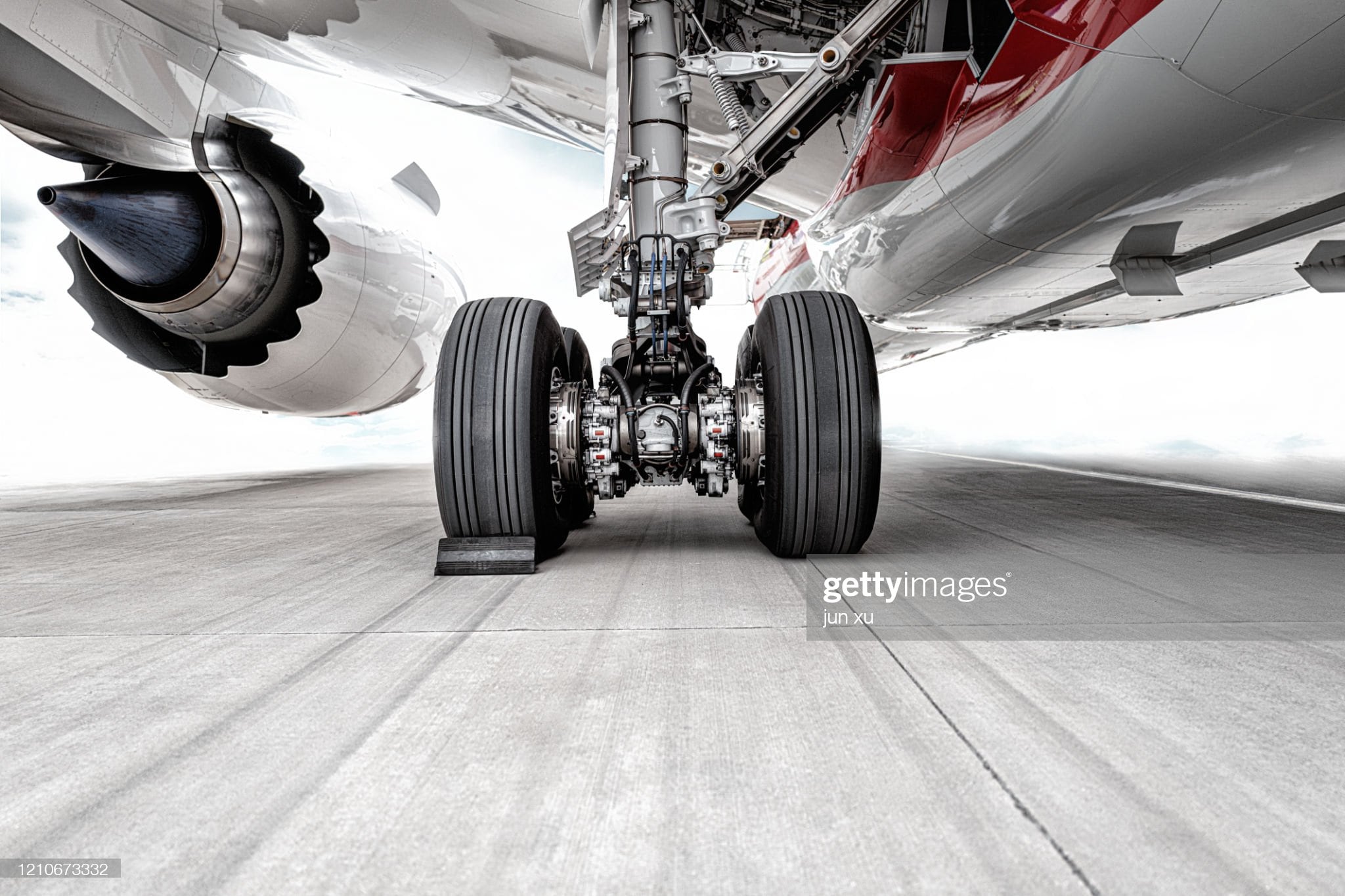 The huge wheels of the plane were parked on the runway of the airport