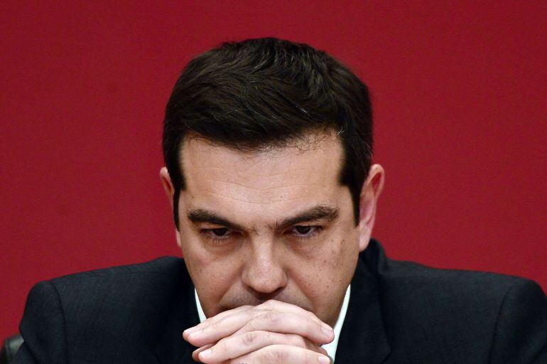 The leader of the leftist Syriza party, Alexis Tsipras, listens to a question during a televised press conference on January 23, 2015 at the Zappion Hall in Athens. Greeks vote on January 25 in a general election for the second time in three years, with r