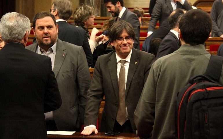 El president de la Generalitat, Carles Puigdemont, y el vicepresident económico, Oriol Junqueras