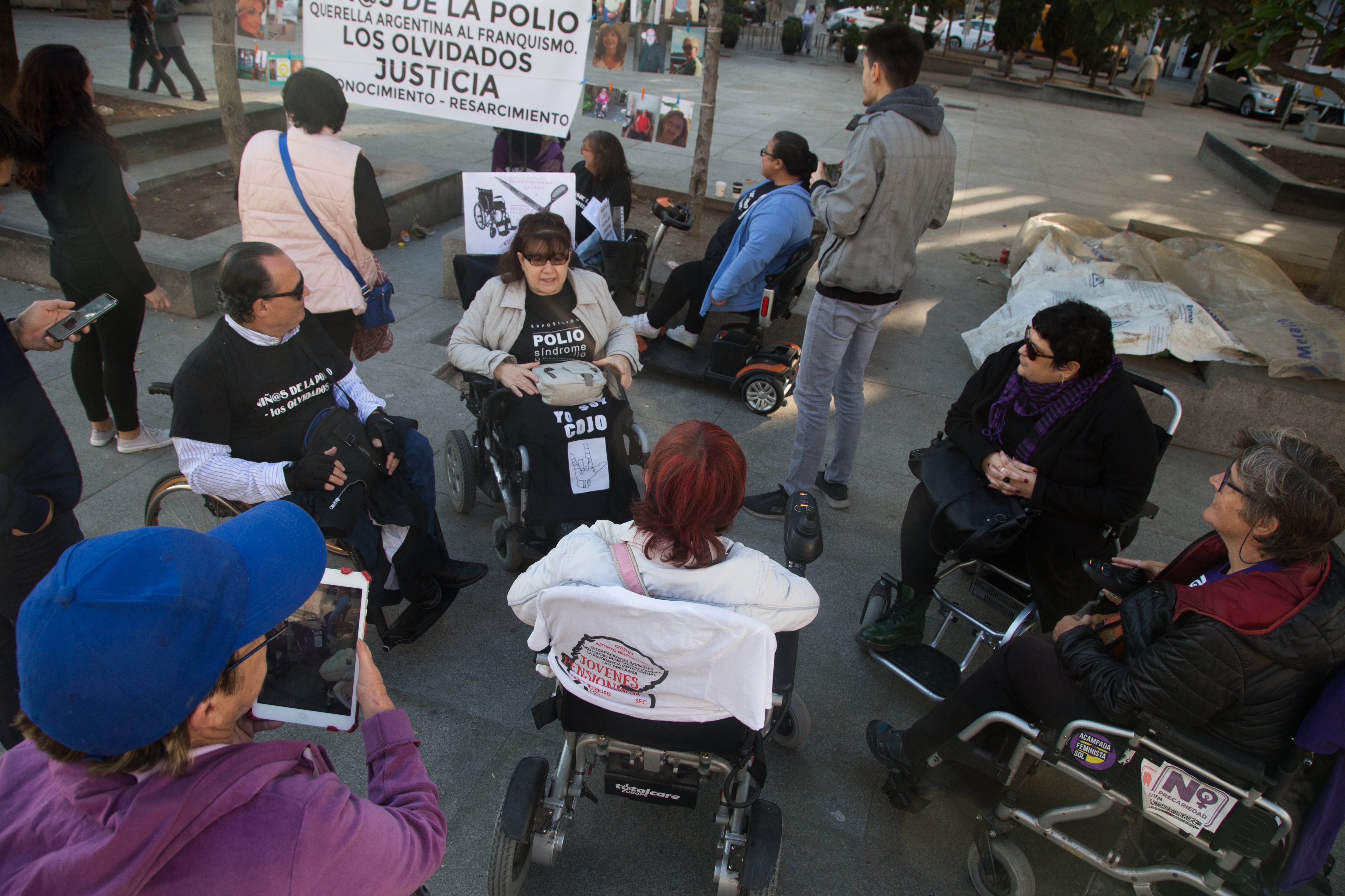 MADRID, SPAIN - 2018/10/24: Group of people with polio and affected by the post polio syndrome are seen speaking about their situation during the protest.Between the years 1950 and 1964, polio died in Spain hundreds of people, whose vaccine did not arrive in Spain until 1963, 10 years after it was invented in the United States today on World Polio Day have demonstrated in front of Congress demanding for justice and recognition, asking specialized doctors accessibility and the recognition of post-polio syndrome as a disease since the virus becomes active again. (Photo by Lito Lizana/SOPA Images/LightRocket via Getty Images)