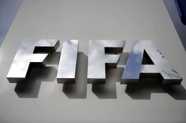 ZURICH, SWITZERLAND - OCTOBER 09: A FIFA logo next to the entrance at the FIFA headquarters on October 9, 2015 in Zurich, Switzerland. On Thursday, FIFA&#039;s Ethics Committee provisionally banned FIFA President Joseph S. Blatter from all football activities 