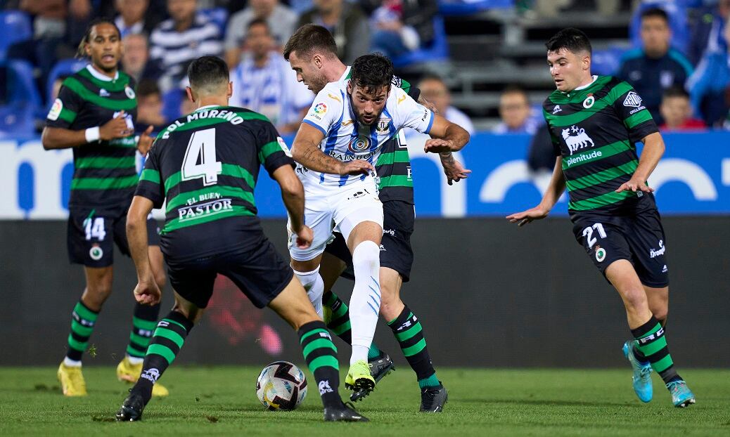 LEGANES, SPAIN - OCTOBER 29: Jose Arnaiz of CD Leganes battle for the ball with Aritz Aldasoro of Racing de Santander during the La Liga Smartbank match between CD Leganes and Racing de Santander at Estadio Municipal de Butarque on October 29, 2022 in Leganes, Spain. (Photo by Diego Souto/Quality Sport Images/Getty Images)