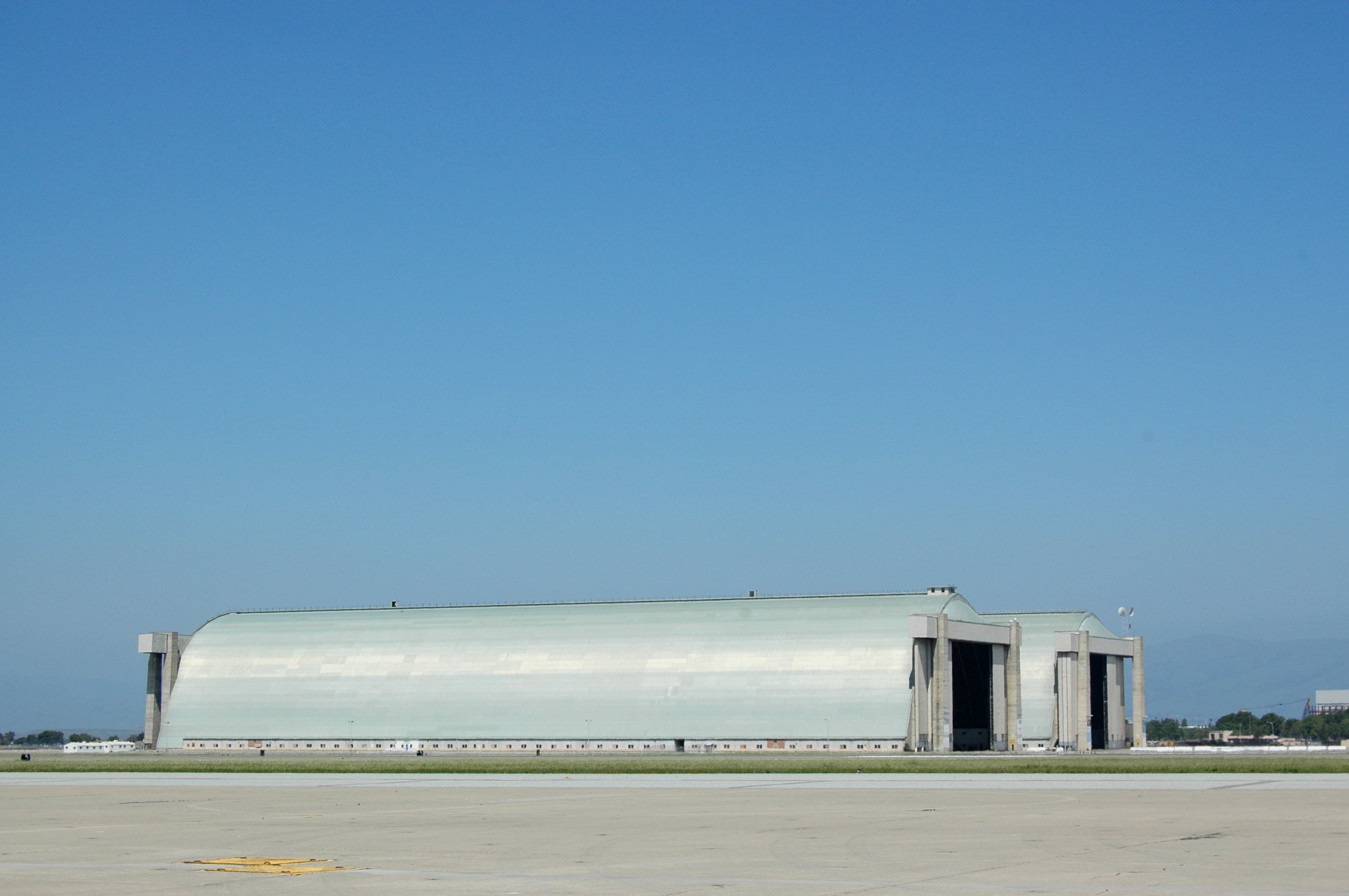 Hangars Number 2 and 3 were built in 1943 to house dirigibles posted at the Golden Gate Bridge to watch for enemy submarines and mines. Located at US Naval Air Station Sunnyvale, later NAS Moffett Field, California. Currently part of NASA Ames Research Center. Hangars are 10 football fields long.